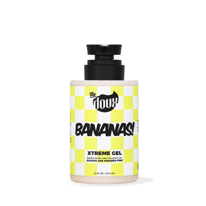 A bottle of The Doux Bananas! Xtreme Gel hair conditioner, featuring a black pump dispenser and a yellow-and-white checkered label, set against a plain white background.