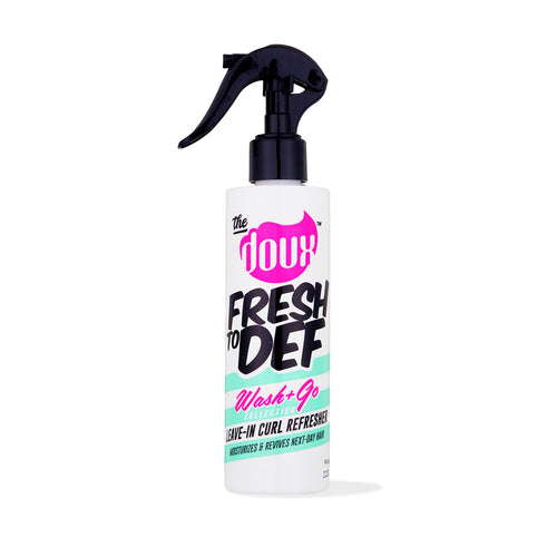 a white spray bottle with black handle
