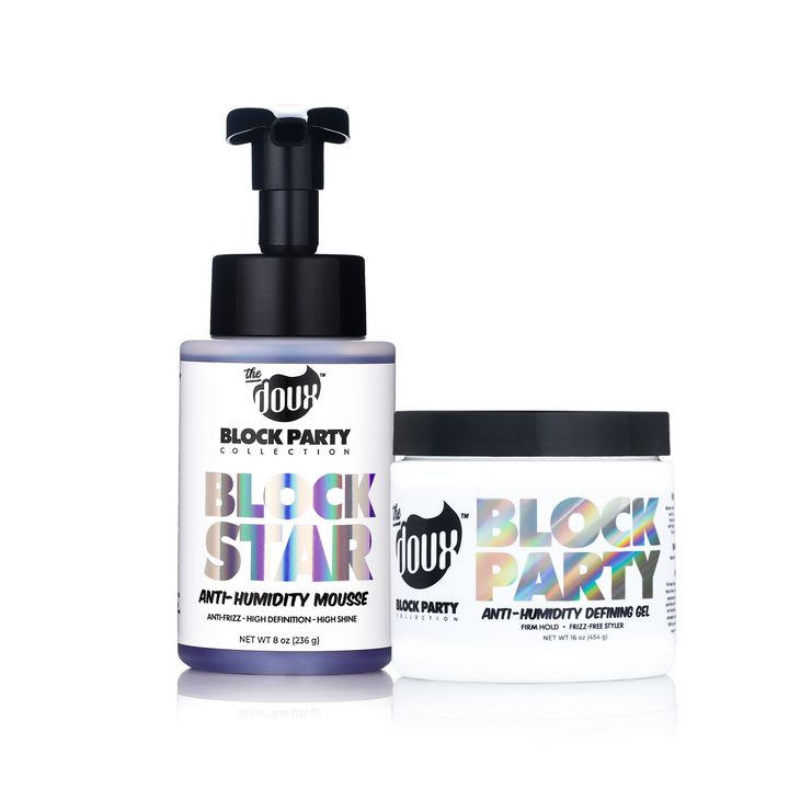 Two hair product containers from The 11th Hour Block Party Collection on a white background: an anti-humidity mousse bottle with a black pump and a defining gel jar with a black lid.