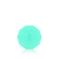 A palm-sized smoothing brush with a unique geometric design, predominantly in a light blue color.

